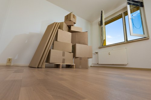 Packed boxes and furniture ready for transport in a Selhurst property