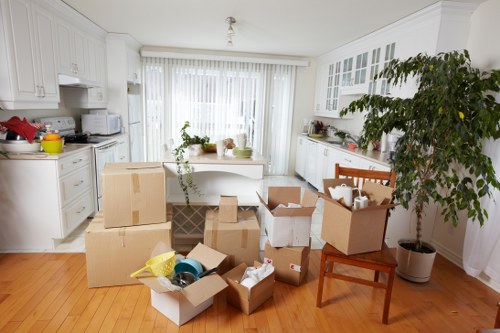 Local movers carrying items from a flat in Selhurst
