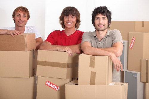 Packed office boxes and furniture ready for collection